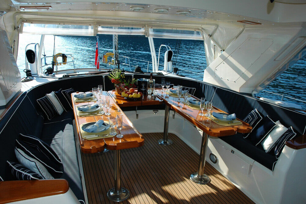 Saloon of large yacht ready for dinner