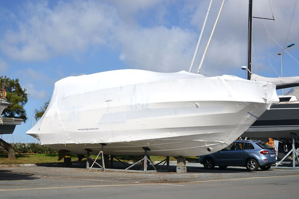 Boat wrapped in white shrink wrap